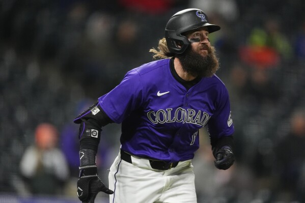 Colorado Rockies' Charlie Blackmon heads up the first-base line after hitting a solo home run off Arizona Diamondbacks relief pitcher Luis Frias in the eighth inning of a baseball game Monday, April 8, 2024, in Denver. (AP Photo/David Zalubowski)
