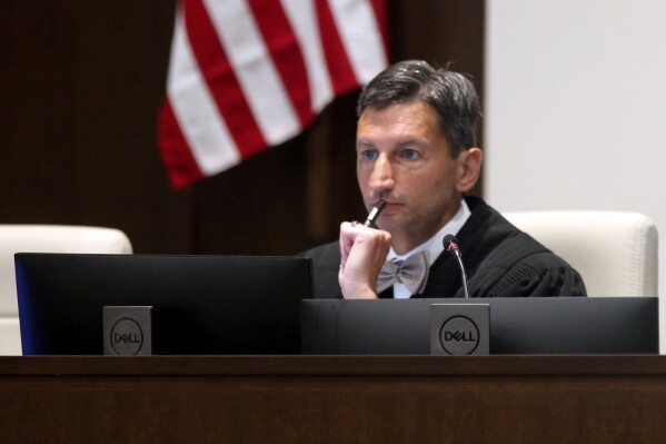 FILE - District Judge K. Christopher Jayaram follows arguments from attorneys as they argue over a new state law on how providers dispense abortion medications, Aug. 8, 2023, in Johnson County District Court in Olathe, Kan. On Monday, Oct. 30, Jayaram blocked enforcement of the new law and older restrictions. (AP Photo/John Hanna, File)