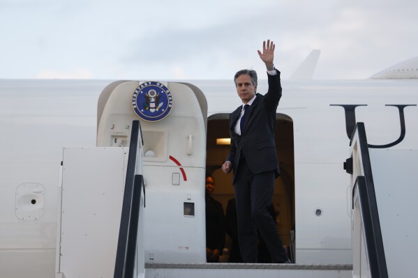 U.S. Secretary of State Antony Blinken gestures, as he departs, at Ben Gurion International airport in Tel Aviv, Israel, Friday March 22, 2024. (Evelyn Hockstein, Pool Photo via AP)