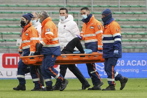PSG's Neymar is carried off the pitch by medical staff on a stretcher after an injury during the French League One soccer between Saint-Etienne and Paris Saint Germain, in Saint-Etienne, central France, Sunday, Nov. 28, 2021. (AP Photo/Laurent Cipriani)