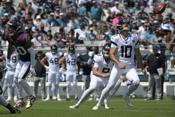 Jacksonville Jaguars place kicker Brandon McManus (10) chases a blocked punt during the first half of an NFL football game against the Houston Texans, Sunday, Sept. 24, 2023, in Jacksonville, Fla. (AP Photo/Phelan M. Ebenhack)