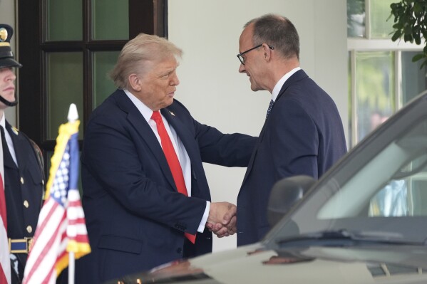 President Donald Trump, left, shakes the hand of Germany's Chancellor Friedrich Merz upon his arrival at the White House, Thursday, June 5, 2025, in Washington. (AP Photo/Alex Brandon)