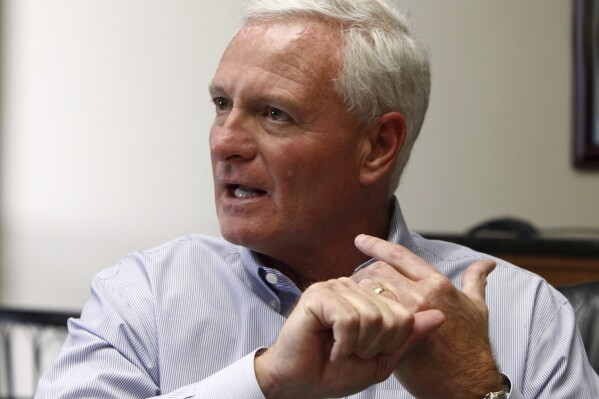 FILE - In this April 19, 2013, file photo, Jimmy Haslam, CEO of Pilot Flying J and owner of the Cleveland Browns, speaks during a news conference at the company headquarters in Knoxville, Tenn. Warren Buffett鈥檚 Berkshire Hathaway says the billionaire Haslam family tried to bribe at least 15 executives at the Pilot truck stop chain with millions of dollars to inflate the company鈥檚 profits this year because that would force Berkshire to pay more for the Haslams鈥� remaining 20% stake in the company. (AP Photo/Wade Payne, File)