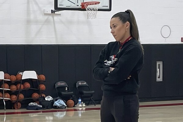 HOLD FOR STORY — Coach Carly Thibault-DuDonis conducts practice at Fairfield University, Thursday, Feb. 15, 2024. The 32-year-old, second-year head coach is leading her team to a 22-1 record on the cusp of their first AP Top 25 ranking. The Stags are currently on a 20-game winning streak. (AP Photo/Pat Eaton-Robb)