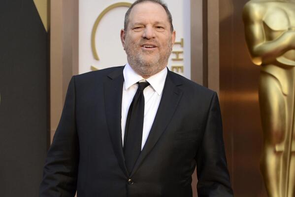 FILE - Movie mogul Harvey Weinstein arrives at the Oscars at the Dolby Theatre in Los Angeles, March 2, 2014. Five years after women's stories about him made the #MeToo movement explode, Weinstein is going on trial in Los Angeles, the city where he once was a colossus at the Oscars. Jury selection for an eight-week trial begins Monday, Oct. 10, 2022. (Photo by Jordan Strauss/Invision/AP, File)