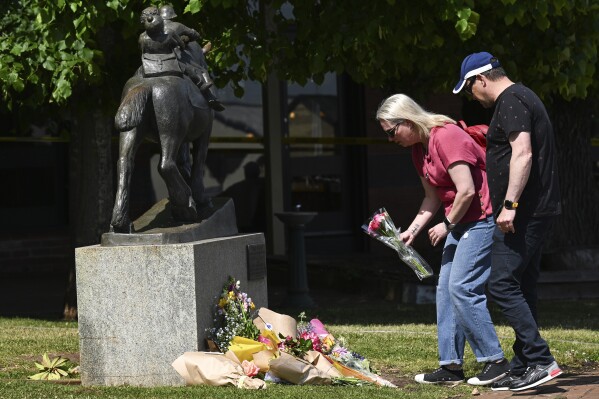 Mourners lay flowers outside the Royal Hotel in Daylesford, Australia, Monday, Nov. 6, 2023. A car crashed into an Australian pub’s outdoor dining area, killing and injuring multiple people, officials said on Monday. (James Ross/AAP Image via AP)