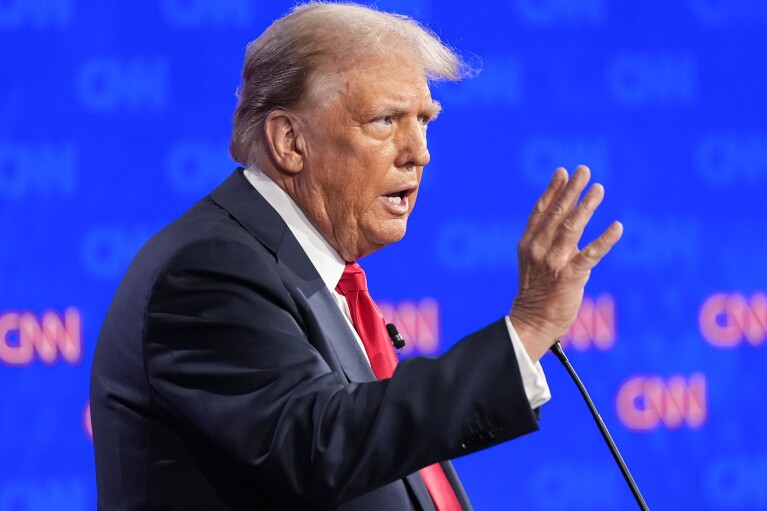 Republican presidential candidate former President Donald Trump gestures during a presidential debate with President Joe Biden, Thursday, June 27, 2024, in Atlanta. (AP Photo/Gerald Herbert)