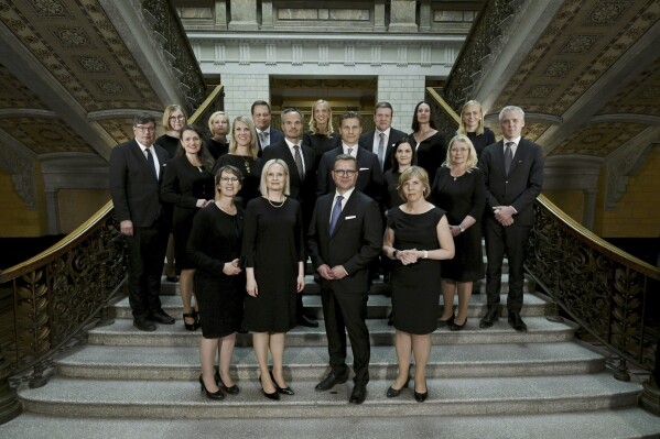 The new Government of Finland led by Prime Minister Petteri Orpo pose for a family picture in Helsinki, Finland on Tuesday, June 20, 2023. First row, from left, Minister of Agriculture and Forestry Sari Essayah, Minister of Finance Riikka Purra, Prime Minister Petteri Orpo and Minister of Education Anna-Maja Henriksson. Second row, from left, Minister of Labour (split into two-year posts) Arto Satonen, Minister for Local and Regional Government Anna-Kaisa Ikonen, Minister for Culture and Science (split into two-year posts) Sari Multala, Minister of the Environment and Climate Change Kai Mykk'nen, Minister of Defence Antti H'kk'nen, Minister for Social Security Sanni Grahn-Laasonen, Minister of Justice Leena Meri and Minister for Europe and Corporate Governance Anders Adlercreutz. Third row, from left, Minister of Social Affairs and Health Kaisa Juuso, Minister of the Interior Mari Rantanen, Minister of Economic Affairs (divided into two-year posts) Vilhelm Junnila, Minister for Sport, Physical Acticity and Youth (split between the SPP and CD for two-year posts) SPP's Sandra Bergqvist, Minister for Foreign Trade and Development Ville Tavio, Minister for Transport and Communications Lulu Ranne and Minister for Foreign Affairs Elina Valtonen. (Antti Aimo-Koivisto/Lehtikuva via AP)