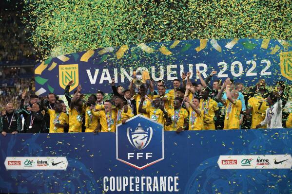 Nantes' players celebrate with the trophy after winning the French Cup final soccer match between Nice and Nantes at the Stade de France stadium, in Saint Denis, north of Paris, Saturday, May 7, 2022. (AP Photo/Christophe Ena)