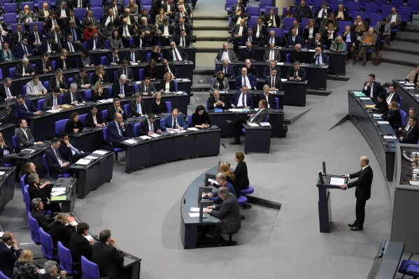 FILE - German Chancellor Olaf Scholz speaks during a general debate on the budget at the German parliament Bundestag in Berlin, Germany, Wednesday, Jan. 31, 2024. German lawmakers have approved Friday, Feb. 2, 2024, cuts to fuel subsidies for farmers that prompted angry protests, along with a 2024 budget that the government had to revamp after a court ruling blew a hole in its financial plans. (AP Photo/Ebrahim Noroozi)
