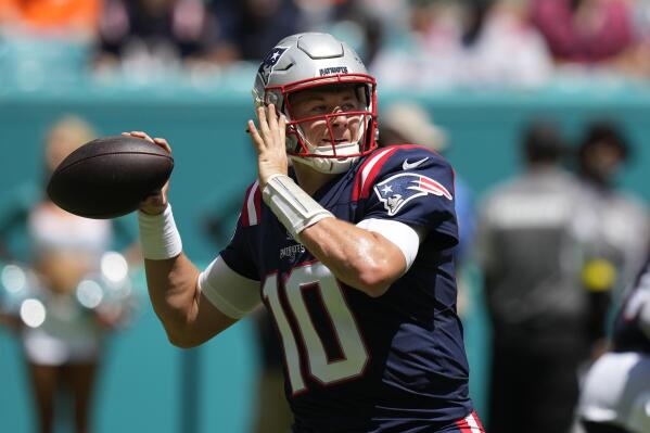 New England Patriots quarterback Mac Jones (10) aims a pass during the first half of an NFL football game against the Miami Dolphins, Sunday, Sept. 11, 2022, in Miami Gardens, Fla. (AP Photo/Rebecca Blackwell)