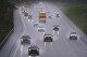 As rain from a nor'easter falls on the pavement, vehicles roll north on Route 93 during the start of the Memorial Day holiday travel, Thursday, May 22, 2025, in Londonderry, N.H. (AP Photo/Charles Krupa)