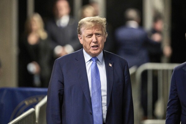 Former President Donald Trump speaks with the media at the end of the day's proceedings in his trial at Manhattan criminal court , Friday, April 26, 2024, in New York. (Curtis Means/DailyMail.com via AP)