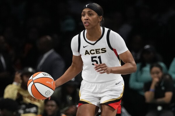 FILE - Las Vegas Aces' Sydney Colson (51) plays during the second half in Game 4 of a WNBA basketball final playoff series against the New York Liberty Wednesday, Oct. 18, 2023, in New York. The WNBA and its players are once again a big part of the Athletes Unlimited basketball season. (AP Photo/Frank Franklin II, File)