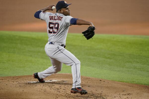 May 30, 2021: Carlos Correa (1) makes a throw to first base for