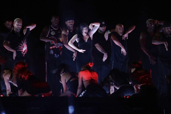 Lady Gaga takes part in a rehearsal a day ahead of her free concert on Copacabana beach, in Rio de Janeiro, Friday, May 2, 2025. (AP Photo/Bruna Prado)