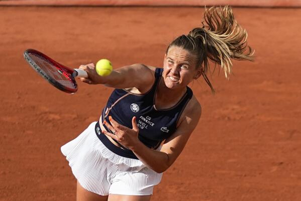 FILE - France's Fiona Ferro serves to Spain's Paula Badosa at the French Open tennis tournament May 24, 2022, in Paris. Ferro, who reached a career-high ranking of No. 39 last year, has accused her former coach of rape and sexual assault. The French Tennis Federation said in a statement Saturday, Sept. 3, 2022, that it is “standing by” Ferro, a 25-year-old who lost in qualifying at the U.S. Open last week. (AP Photo/Michel Euler, File)