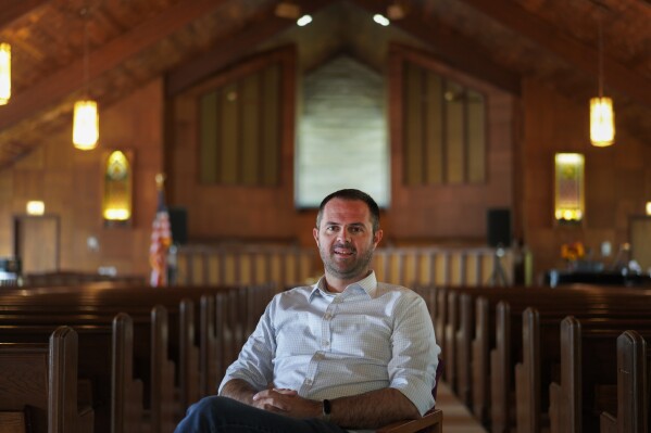 FILE - Pastor Ryan Burge, an associate professor of political science at Eastern Illinois University and author of "The Nones," poses for a portrait at at First Baptist Church in Mt. Vernon, Ill., Sept. 10, 2023. (ĢӰԺ Photo/Jessie Wardarski, File)