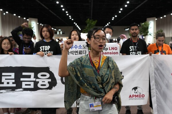 Activists participate in a demonstration against fossil fuels at the COP28 U.N. Climate Summit, Tuesday, Dec. 5, 2023, in Dubai, United Arab Emirates. (AP Photo/Rafiq Maqbool)