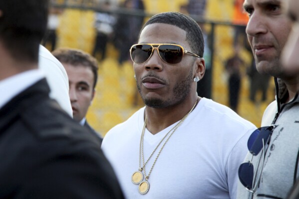 FILE - Rapper Nelly approaches the stage for a concert in Erbil, northern Iraq, March 13, 2015. (AP Photo/Seivan M. Salim, File)