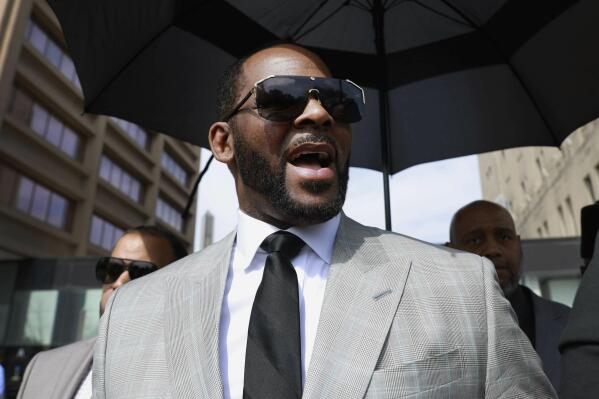 FILE - R&B singer R. Kelly leaves the Leighton Criminal Court building in Chicago on June 6, 2019. The R&B superstar's musical accomplishments have long been shadowed by allegations that he sexually abused women and children. The singer is scheduled to be sentenced Thursday, Feb. 23, 2022, in his hometown of Chicago after he was found guilty in September of child pornography and child enticement. (AP Photo/Amr Alfiky, File)