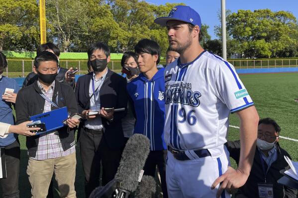 Yokohama BayStars Trevor Bauer is surrounded by the reporters in Yokosuka, Japan, Sunday, April 16, 2023. Bauer pitched four innings Sunday for the Yokohama BayStars minor league team in Yokosuka as he prepares to pitch his first game for the Yokohama team. (AP Photo/Stephen Wade)