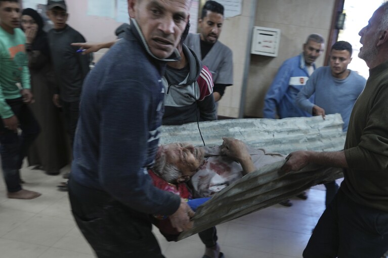 FILE - Palestinians wounded in the Israeli bombardment of the Gaza Strip are brought to Al-Aqsa Martyrs Hospital in Deir al Balah, Gaza Strip, Friday, March 8, 2024. (AP Photo/Adel Hana, File)