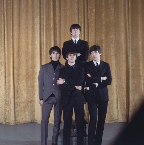The Beatles are shown on the set of the "Ed Sullivan Show" in New York, Feb. 9, 1964. In back is John Lennon; the others, from left to right, are: George Harrison, Ringo Starr and Paul McCartney. (AP Photo)