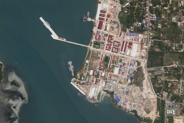 This satellite photo taken by Planet Labs PBC shows two Chinese corvettes docked at the Ream Naval Base on the Gulf of Thailand on Wednesday, May 8, 2024. Cambodia's Defense Ministry insisted Wednesday that the monthslong presence of two Chinese warships at a strategically important naval base that has been newly expanded with funding from Beijing does not constitute a permanent deployment of the Chinese military in the country. (Planet Labs PBC via AP)