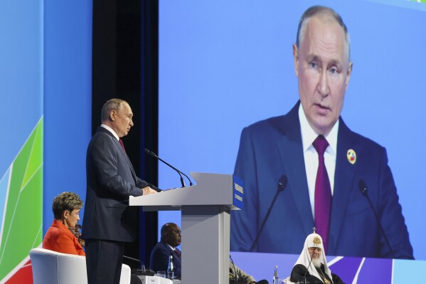 Russian President Vladimir Putin addresses the plenary session of the Russia-Africa Economic and Humanitarian Forum in St. Petersburg, Russia, Thursday, July 27, 2023. (VAlexander Ryumin/TASS Host Photo Agency Pool Photo via AP)