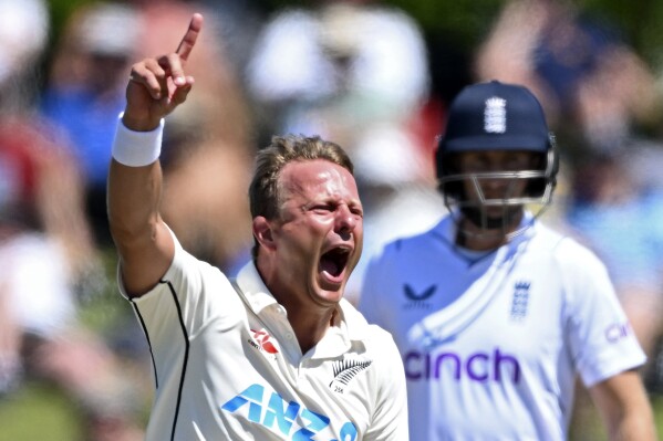 FILE - New Zealand's Neil Wagner celebrates the wicket of England's Ollie Pope on the third day of their cricket test match in Tauranga, New Zealand, on Feb. 18, 2023. The hard-working and durable New Zealand fast bowler Wagner has announced his retirement from test cricket at 37. (Andrew Cornaga/Photosport via AP, File)