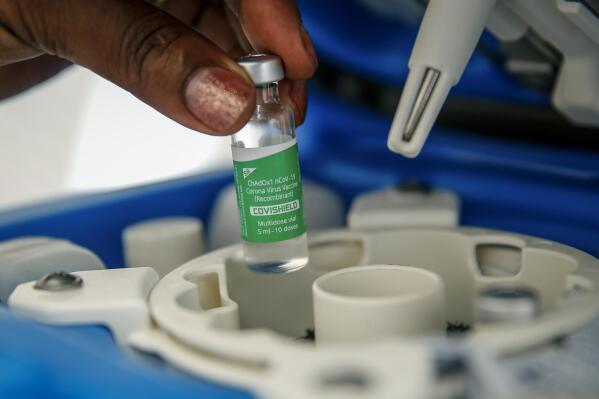 FILE - In this March 24, 2021, file photo, a vial of the AstraZeneca COVID-19 vaccine, manufactured by the Serum Institute of India and provided through the global COVAX initiative, is removed from a portable cold storage box in preparation for a vaccination, in Machakos, Kenya. France joined the United States on Thursday, May 6, in supporting an easing of patent and other protections on COVID-19 vaccines that could help poorer countries get more doses and speed the end of the pandemic. (AP Photo/Brian Inganga, File)