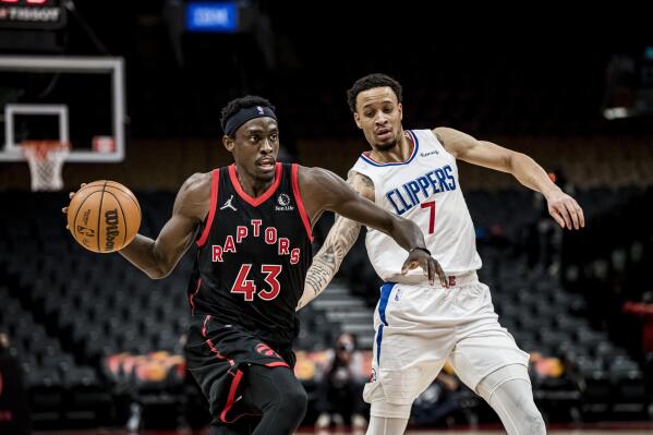 Toronto Raptors forward Pascal Siakam (43) is defended by Los Angeles Clippers guard Amir Coffey (7) during the second half of an NBA basketball game Saturday, Dec. 31, 2021, in Toronto. (Chris Katsarov/The Canadian Press via AP)