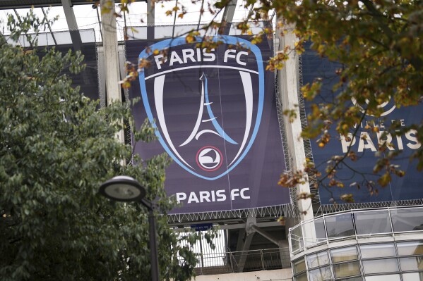 The Paris FC soccer club banner is seen outside the Charlety stadium in Paris, France, Thursday, Oct.17, 2024. (AP Photo/Thibault Camus, File)