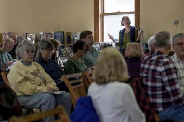 Julie Bomengen speaks during the annual Town Meeting to advocate for an extra $500 in the town's budget for the Lamoille Community Food Share, Tuesday, March 5, 2024 in Elmore, Vt. An impassioned speech by Bomengen secured the extra $500 raising Elmore's annual contribution to $750. (AP Photo/David Goldman)