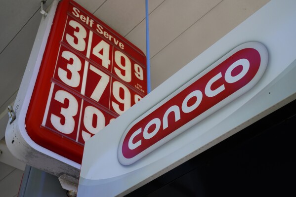 FILE - A Conoco gas station sign is shown in Glenside, Pa., Sept. 29, 2021. ConocoPhillips is buying Marathon Oil in an all-stock deal valued at approximately $17.1 billion as energy prices soar and big oil companies reap massive profits.(AP Photo/Matt Rourke, File)