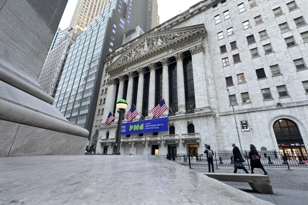 Pedestrians pass the New York Stock Exchange on Tuesday, Feb. 20, 2024 in New York. (APPhoto/Peter Morgan)