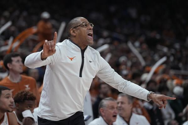 Texas interim coach Rodney Terry signals to players during the first half of the team's NCAA college basketball game against Oklahoma State in Austin, Texas, Tuesday, Jan. 24, 2023. (AP Photo/Eric Gay)