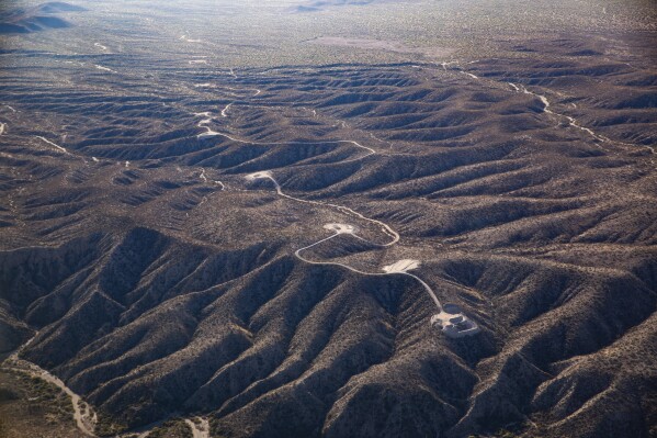 This aerial photo taken on Nov. 13, 2023, by Archaeology Southwest with a volunteer pilot and Lighthawk, a nonprofit organization, shows new access roads and tower pad sites west of the San Pedro River, near Redrock Canyon, in Arizona. The image was included in a lawsuit filed Jan. 17, 2024, asking a U.S. District Court in Arizona to order work to stop on a $10 billion transmission line slated to carry electricity produced by a huge wind power project in central New Mexico to markets including California. (Archaeology Southwest via AP)