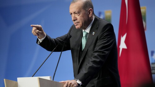 Turkish President Recep Tayyip Erdogan, center, leaves after addressing a media conference at a NATO summit in Vilnius, Lithuania, Wednesday, July 12, 2023. NATO leaders gathered Wednesday to launch a highly symbolic new forum for ties with Ukraine, after committing to provide the country with more military assistance for fighting Russia but only vague assurances of future membership. (AP Photo/Pavel Golovkin)