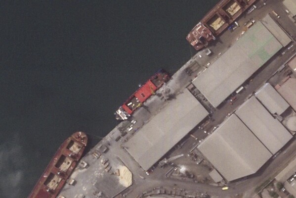 This satellite image provided by Planet Labs PBC shows the Russian flagged cargo ship, Patria, unloading military vehicles, May, 27, 2024, in Conakry, Guinea. (Planet Labs PBC via AP)