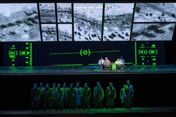 This image released by the Washington National Opera shows a scene from "Grounded," an opera about a female fighter pilot who is reassigned to direct unmanned drone attacks on terrorists thousands of miles away. The opera is having its world premiere at the Washington National Opera. (Scott Suchman/Washington National Opera via AP)