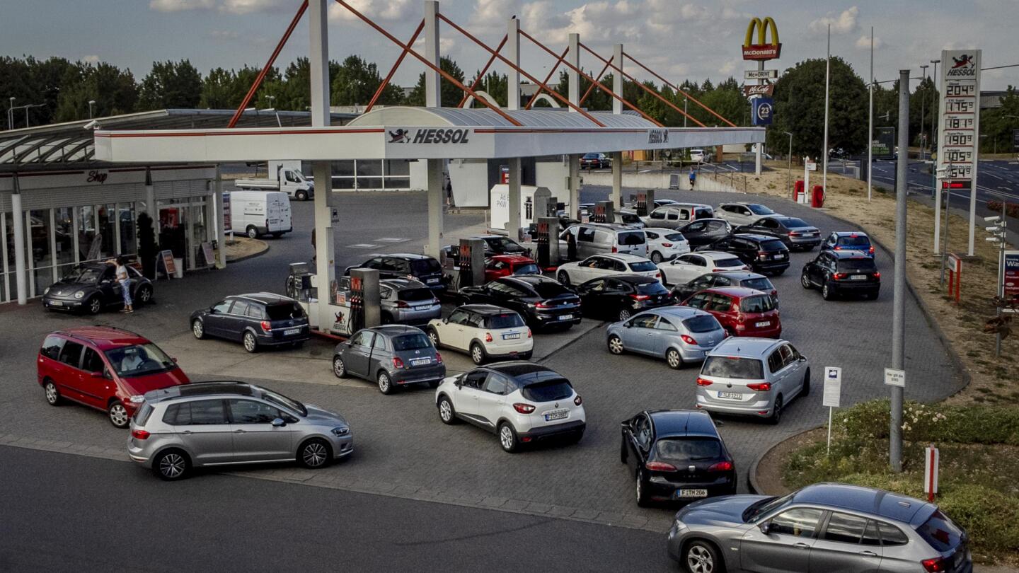 Oil producers’ cuts could boost gasoline prices, help Russia