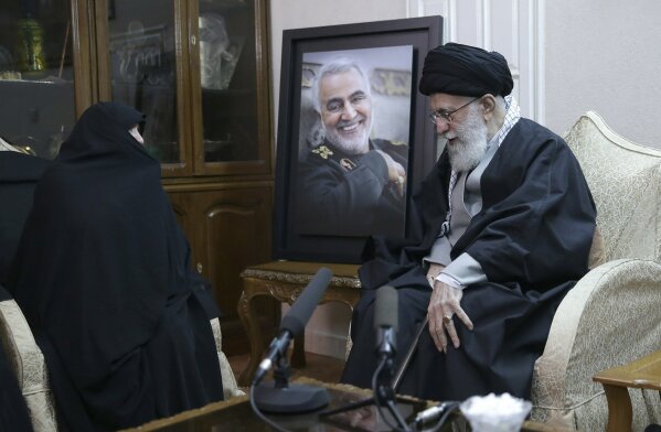 FILE - In this Friday, Jan. 3, 2020 file photo released by the official website of the office of the Iranian supreme leader, Supreme Leader Ayatollah Ali Khamenei, right, meets family of Iranian Revolutionary Guard Gen. Qassem Soleimani, who was killed in the U.S. airstrike in Iraq, at his home in Tehran, Iran. Khamenei, Iran's most powerful figure, wept inconsolably and openly in Tehran on Monday, Jan. 6, 2020, as he prayed over the casket of Soleimani, the military commander killed by a U.S. airstrike in Iraq. (Office of the Iranian Supreme Leader via AP, File)