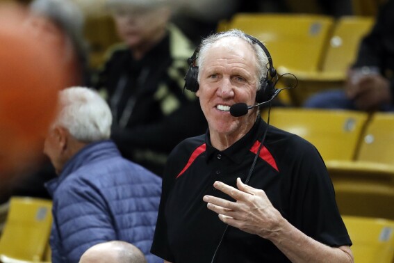 Broadcaster Bill Walton looks in during the first half of an NCAA college basketball game Thursday, March 7, 2019, in Boulder, Colo. (AP Photo/David Zalubowski, File)