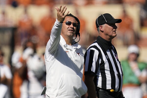 Texas head coach Steve Sarkisian, left, argues a call during the second half of an NCAA college football game against Kansas State in Austin, Texas, Saturday, Nov. 4, 2023. (AP Photo/Eric Gay)