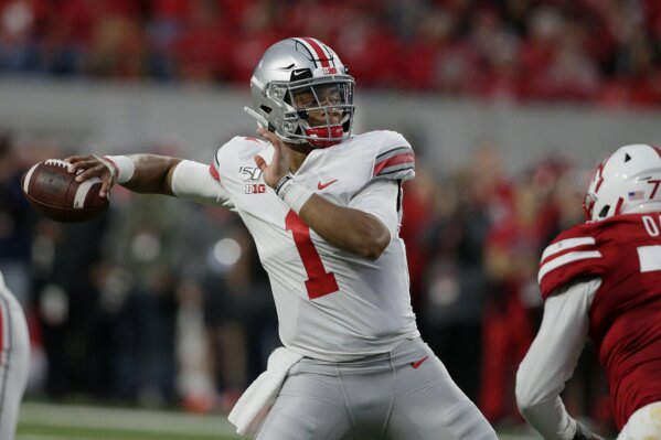FILE - In this Saturday, Sept. 28, 2019, file photo, Ohio State quarterback Justin Fields (1) throws a pass during the first half of an NCAA college football game against Nebraska in Lincoln, Neb. Ohio State hosts Nebraska on Saturday, Oct. 24, 2020. (AP Photo/Nati Harnik, File)