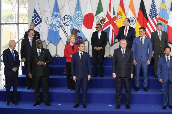 U.S. President Joe Biden, Democratic Republic of Congo's President and African Union Chair Felix Tshisekedi, French President Emmanuel Macron, and Turkey's President Recep Tayyip Erdogan, from row from left, pose with other world leaders for a group photo at the La Nuvola conference center for the G20 summit in Rome, Saturday, Oct. 30, 2021. The two-day Group of 20 summit is the first in-person gathering of leaders of the world's biggest economies since the COVID-19 pandemic started. (AP Photo/Kirsty Wigglesworth, Pool)