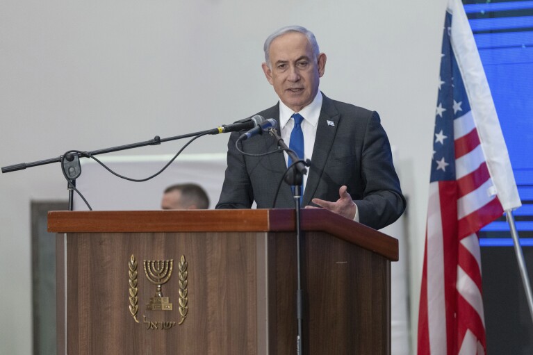 FILE - Prime Minister Benjamin Netanyahu speaks during a gathering of Jewish leaders at the Museum of Tolerance in Jerusalem, Sunday, Feb. 18, 2024. Israel can either try to annihilate Hamas, which would mean almost certain death for the estimated 100 hostages still held in Gaza, or it can cut a deal that would allow the militants to claim a historic victory. Either outcome would be excruciating for Israelis. Either would likely seal an ignominious end for Prime Minister Benjamin Netanyahu's long political career. And either might be seen as acceptable by Hamas, which valorizes martyrdom. (AP Photo/Ohad Zwigenberg, File)