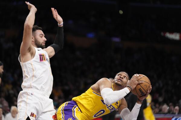Schröder propels Lakers past Heat 112-109 without LeBron, AD
